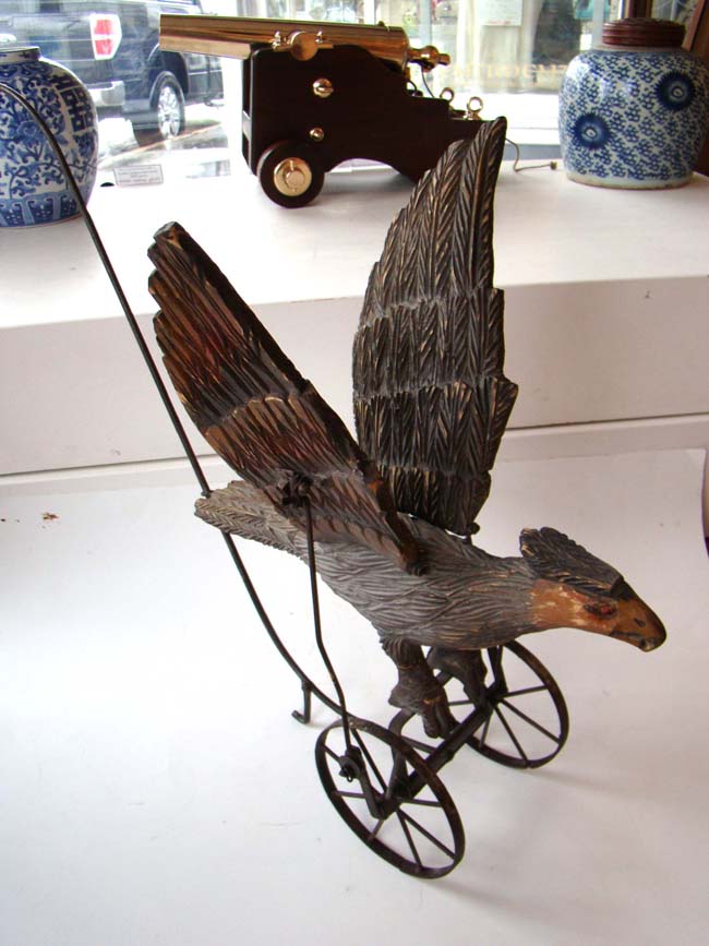 A late Victorian carved wooden spread wing eagle push toy — image 11